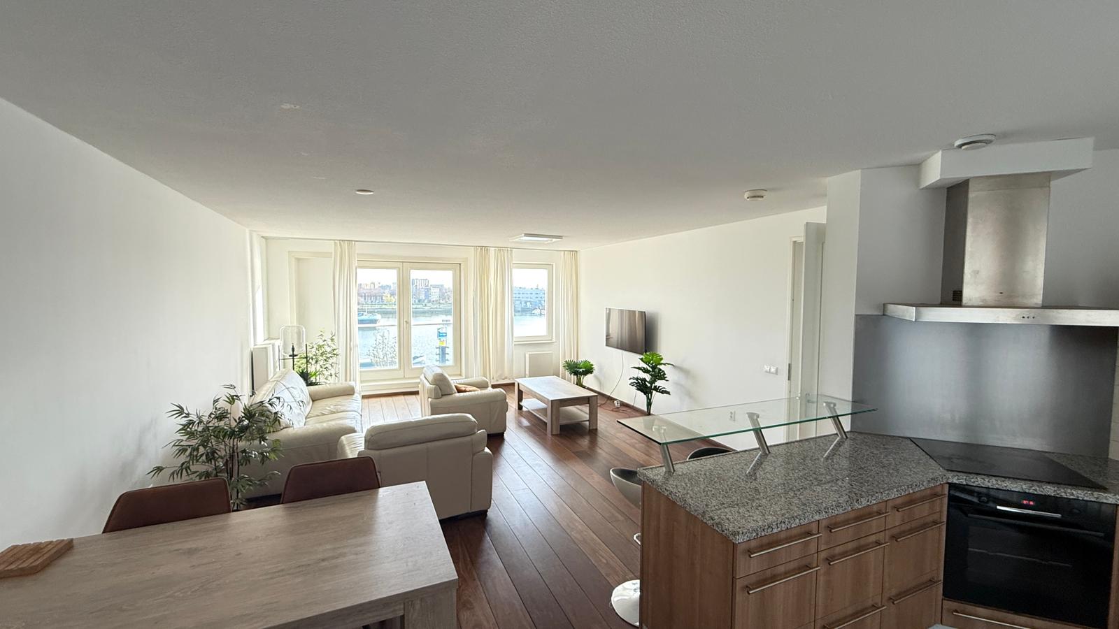 Bright open-plan living room with river views